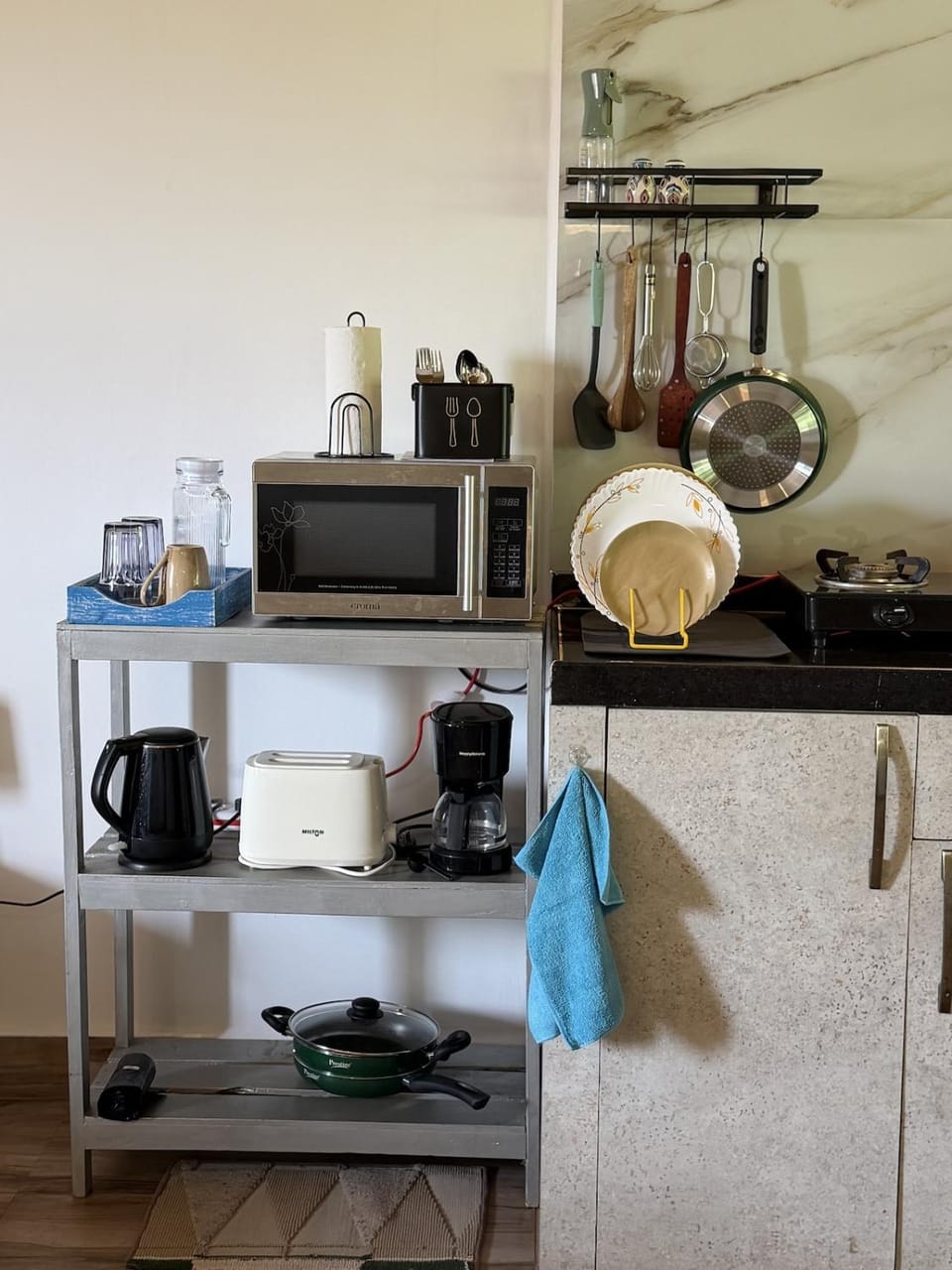 Kitchen or kitchenette, microwave, stove, toaster
