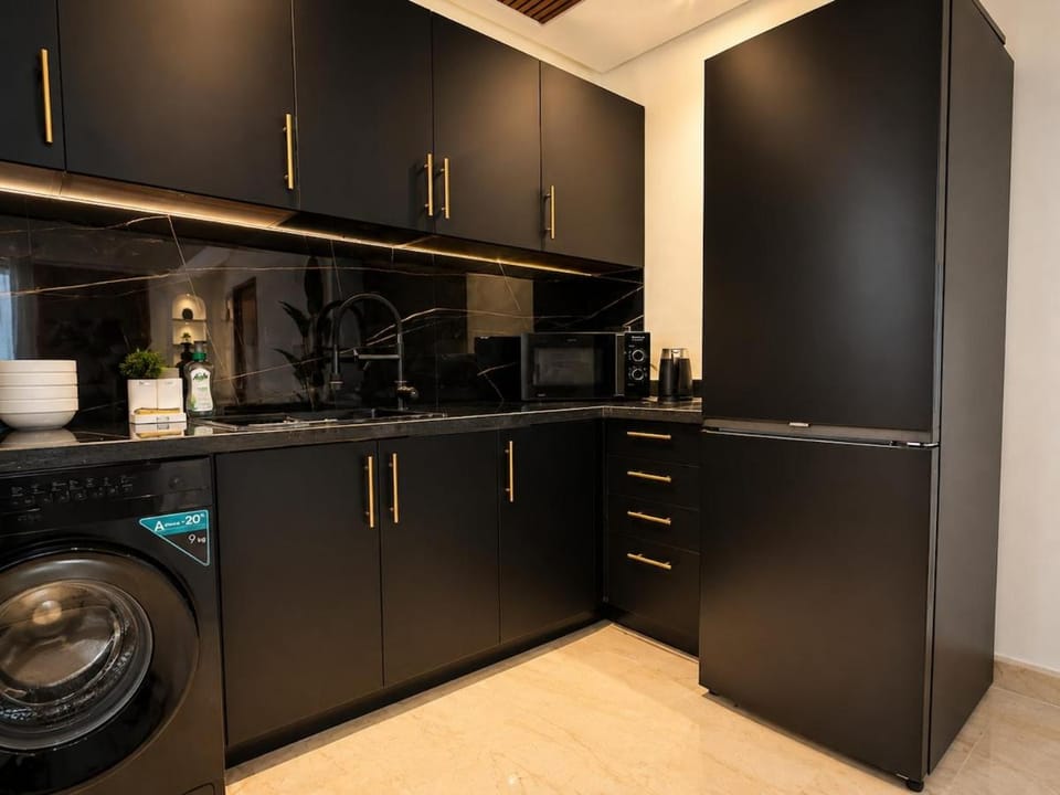 Kitchen or kitchenette, washing machine