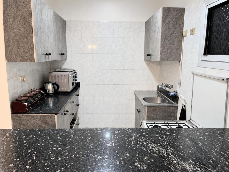Kitchen or kitchenette, oven, stove