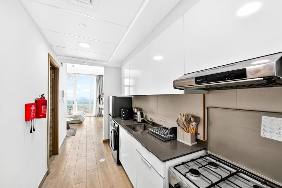 Kitchen or kitchenette, dishwasher, oven, stove