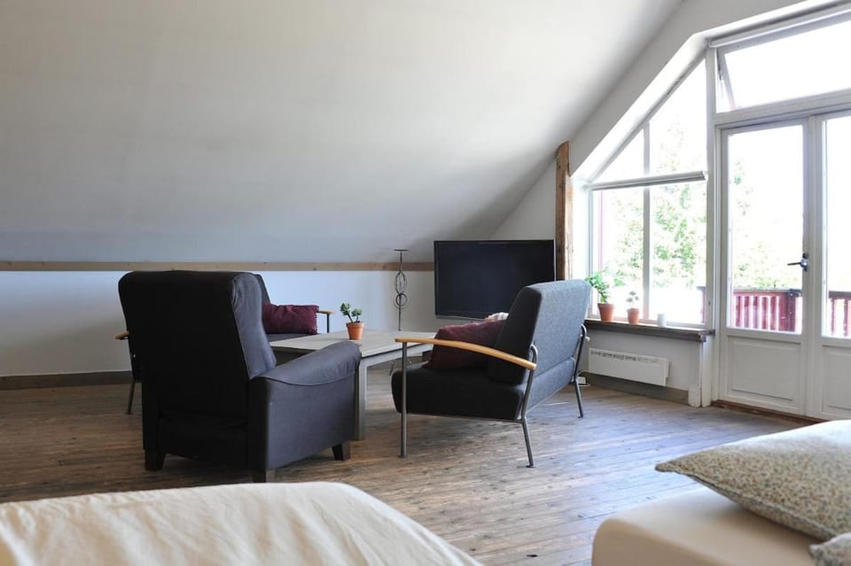 Farmhouse living room with open solution 1 km from Torp Airport Apartment in Viken, Norway