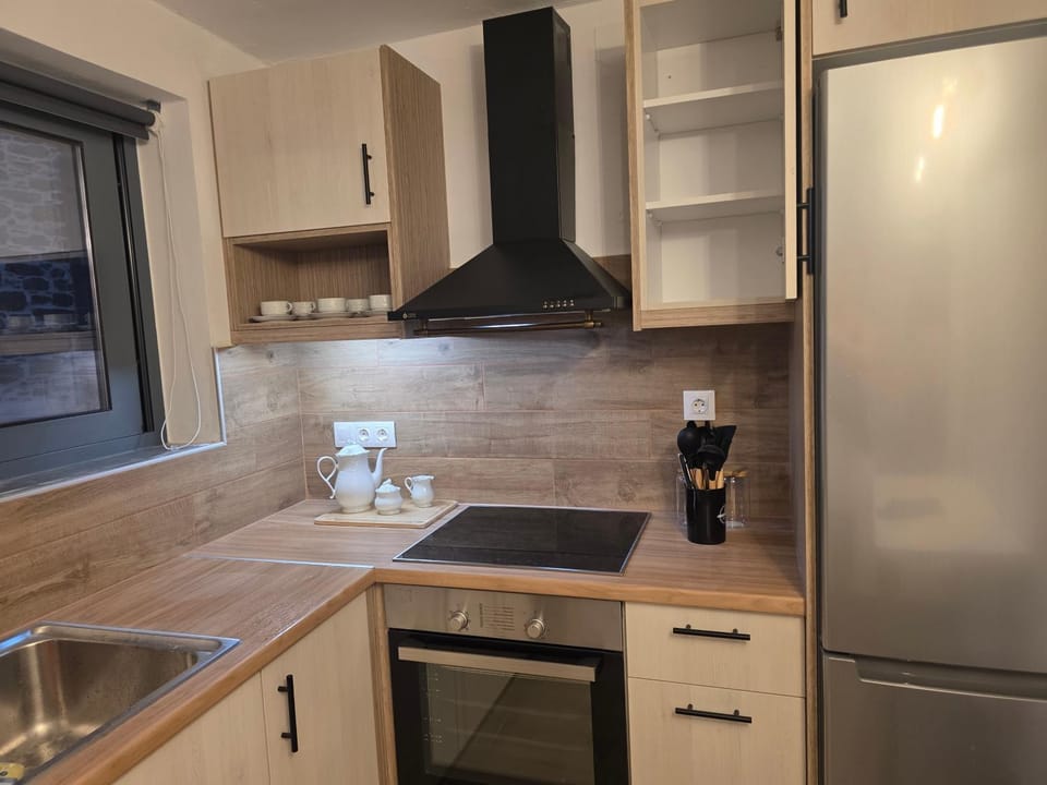 Kitchen or kitchenette, dishwasher, oven, stove