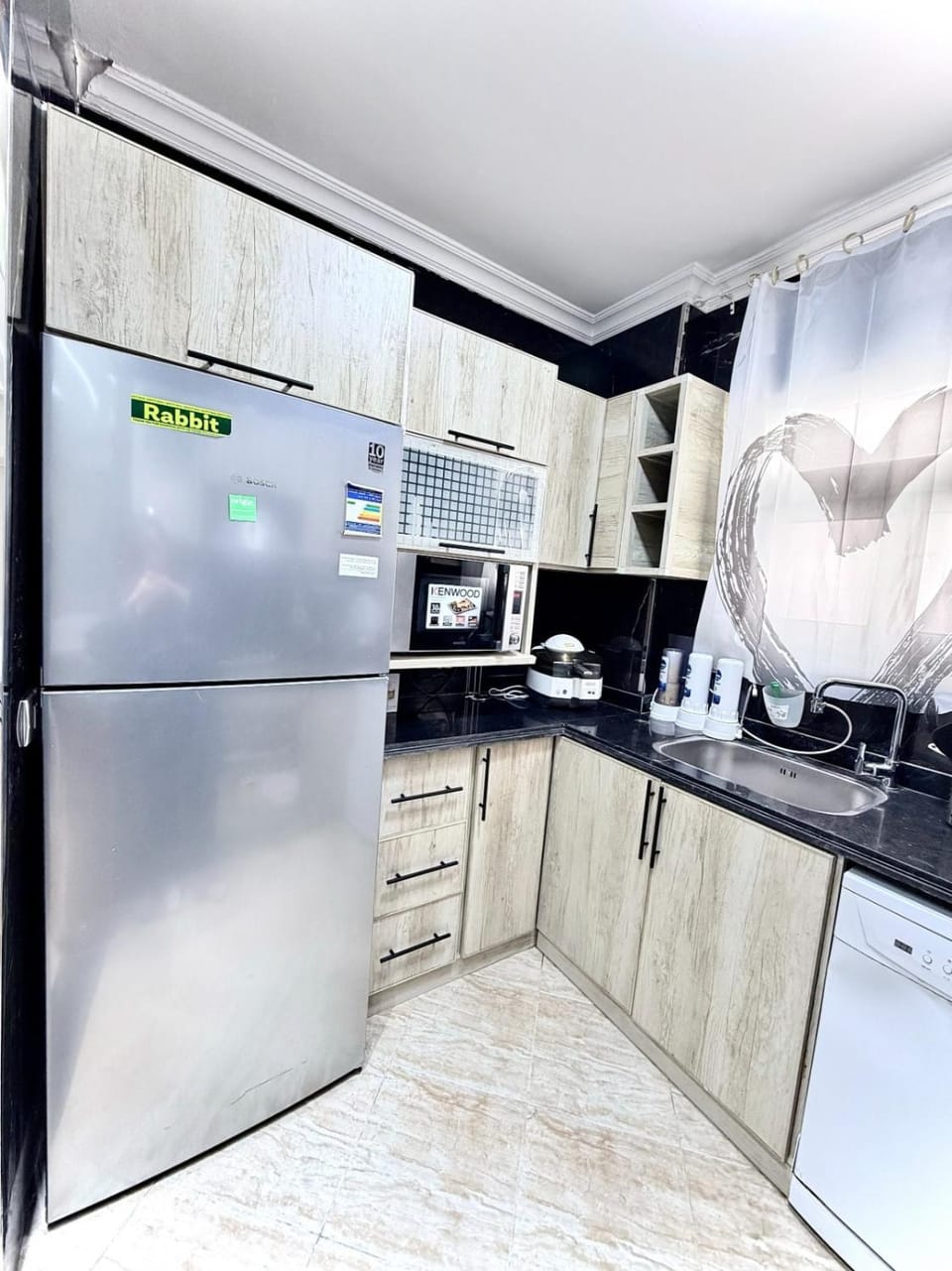 Kitchen or kitchenette, dishwasher, oven, stove, toaster