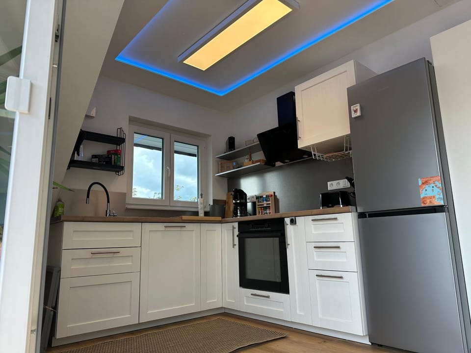 Kitchen or kitchenette, dishwasher, oven, stove, toaster