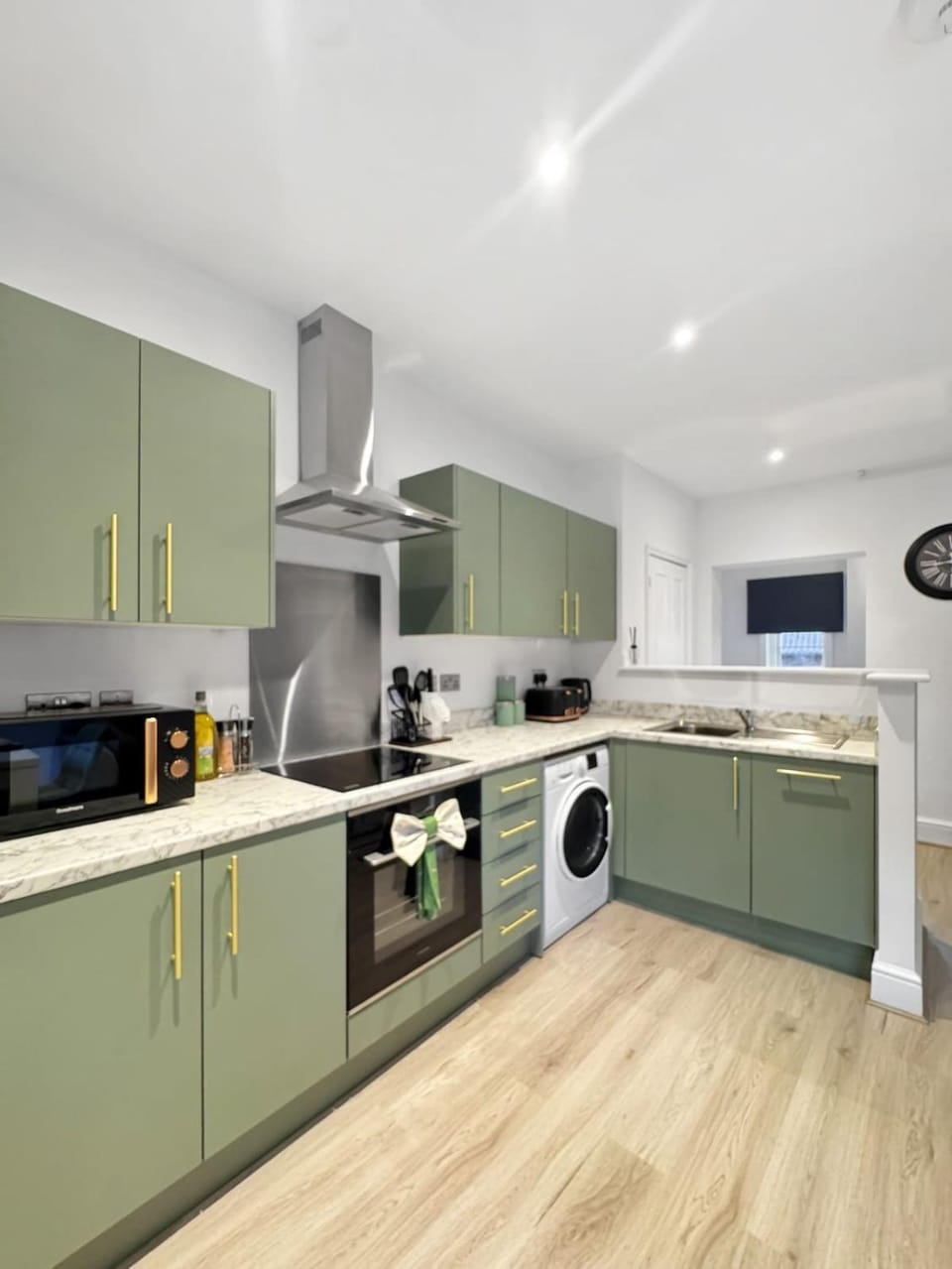 Kitchen or kitchenette, dishwasher, oven, stove, toaster, washing machine, dryer
