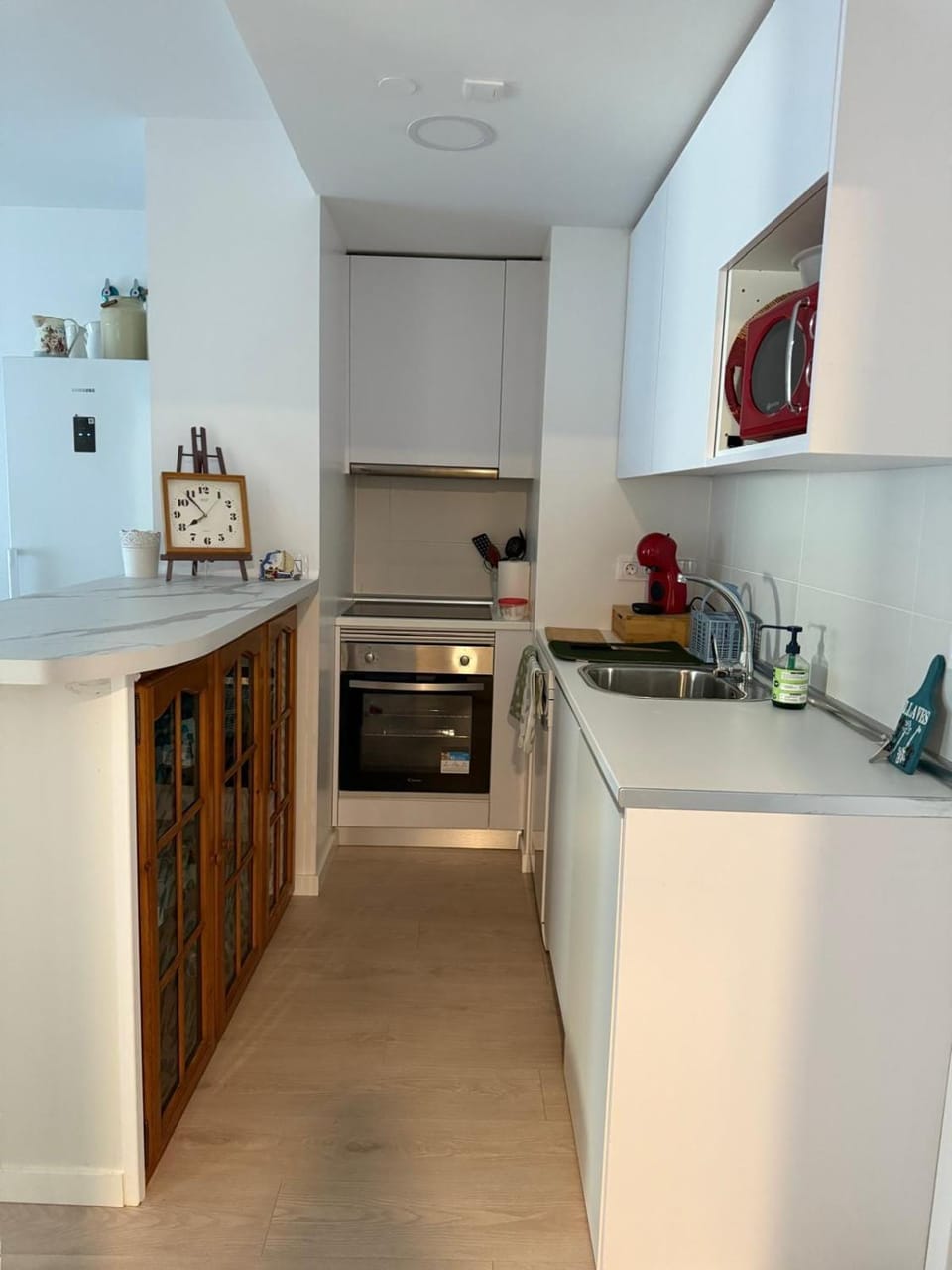 Kitchen or kitchenette, dishwasher, oven, stove
