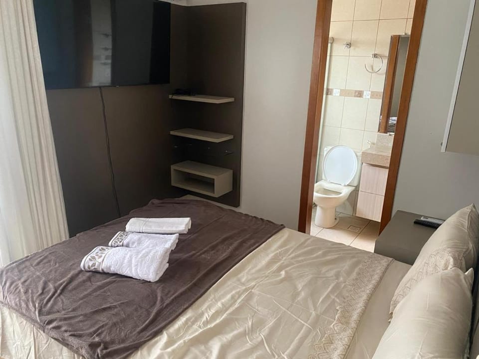 Toilet, Bed, Bathroom, Photo of the whole room, Bedroom, towels, wardrobe