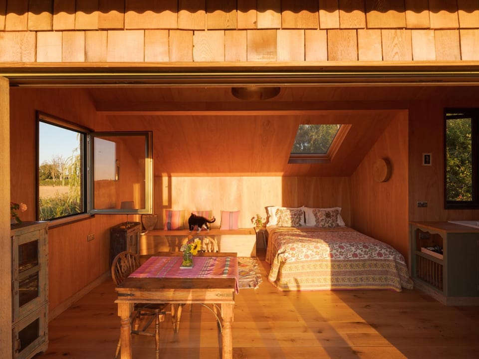 Bed, Living room, Seating area, Bedroom