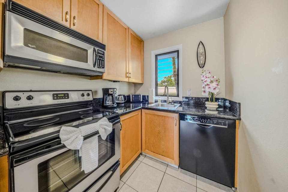 Kitchen or kitchenette, dishwasher, microwave, oven, stove, toaster
