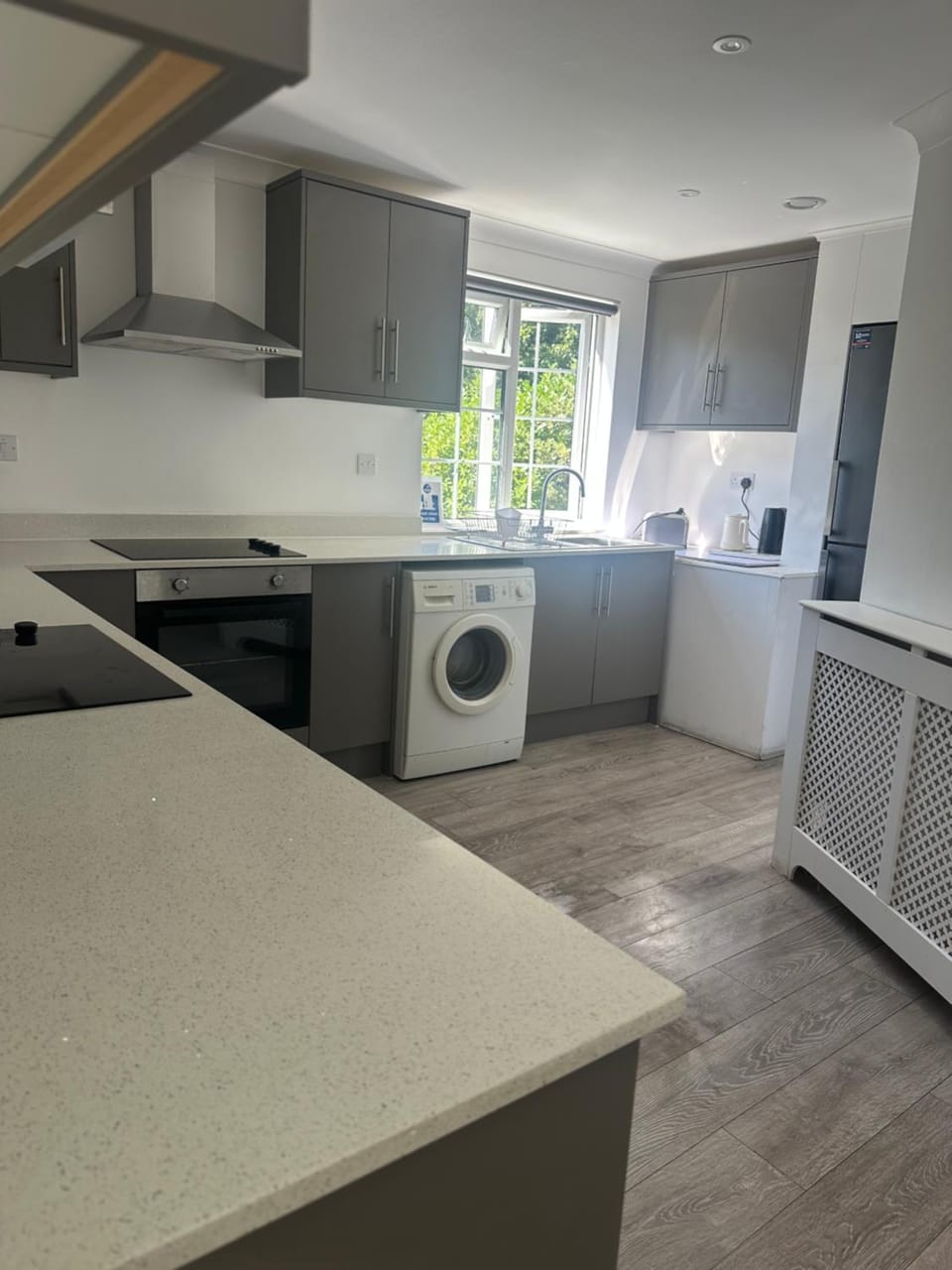 Kitchen or kitchenette, oven, stove, washing machine