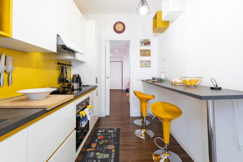 Homevo Orange Design Home M5 Bicocca Apartment in Milan