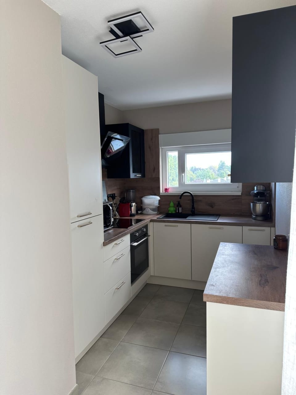 Kitchen or kitchenette, dishwasher, oven, stove, toaster