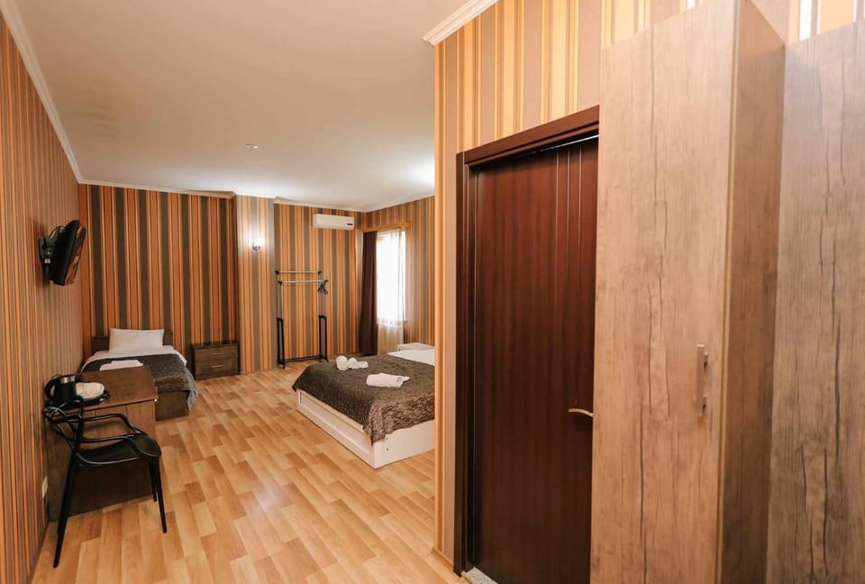 Bed, TV and multimedia, Seating area, Bedroom, wardrobe