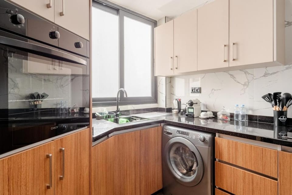 Kitchen or kitchenette, oven, stove, washing machine
