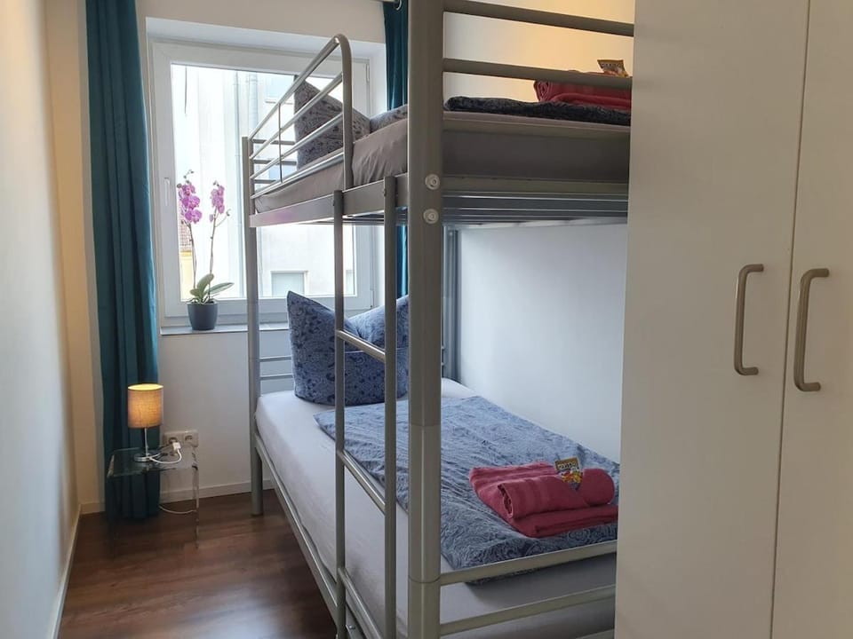 Bedroom, bunk bed, towels, wardrobe