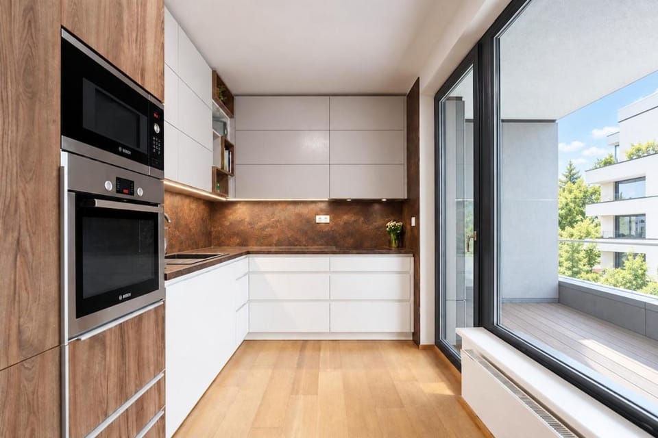 Kitchen or kitchenette, dishwasher, oven, stove