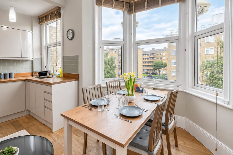 Property building, View (from property/room), Kitchen or kitchenette, Living room, Decorative detail, Seating area, Dining area, dishwasher, flat iron, storage, washing machine, dryer