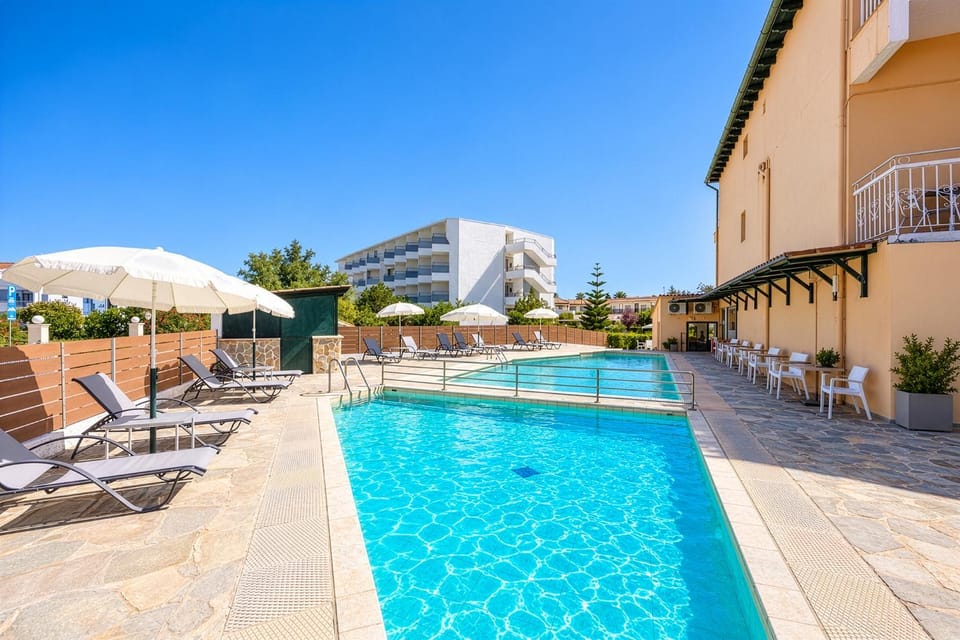 Property building, Day, Pool view, Swimming pool, sunbed