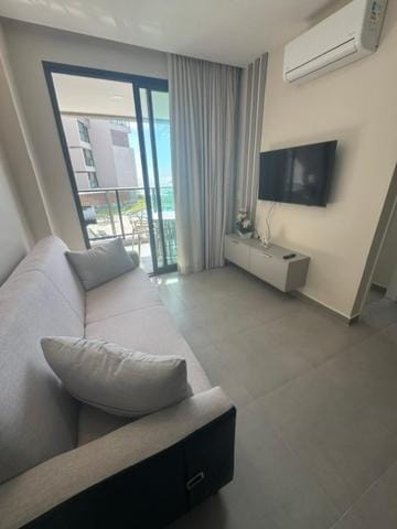 Communal lounge/ TV room, Living room, Seating area, air conditioner