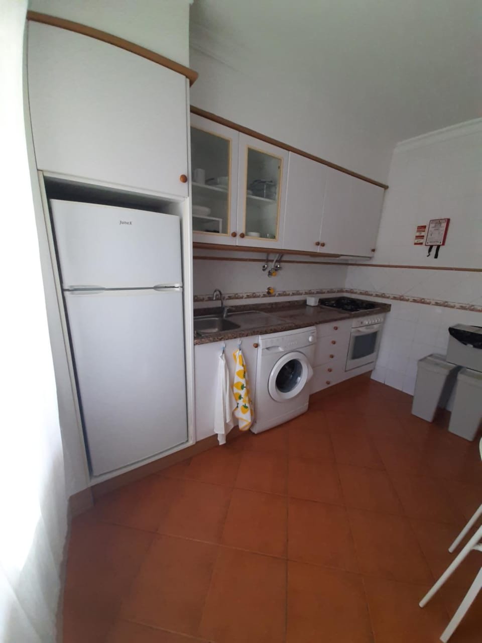Kitchen or kitchenette, stove, washing machine