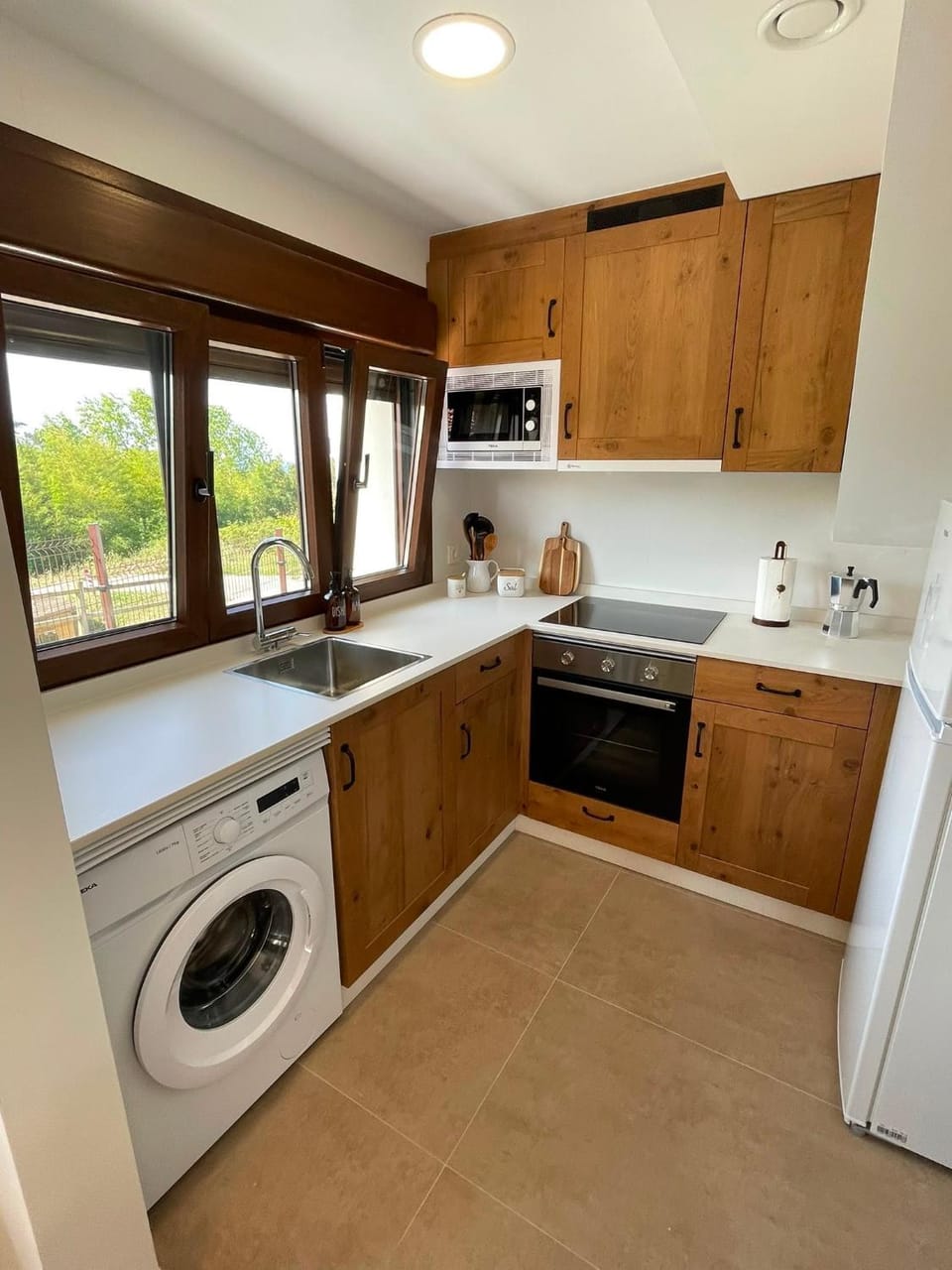 Kitchen or kitchenette, oven, stove, washing machine