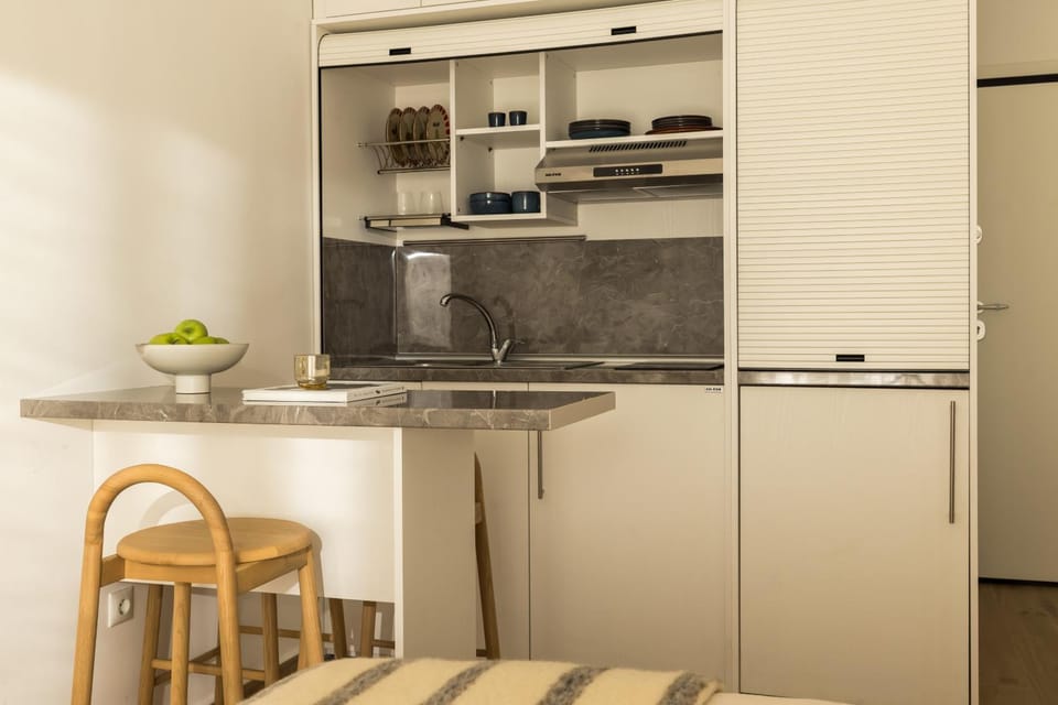 Dining area, minibar, oven, stove