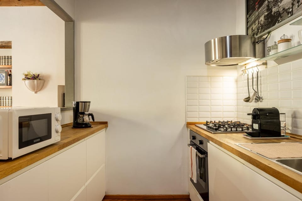 Kitchen or kitchenette, dishwasher, oven, stove, toaster