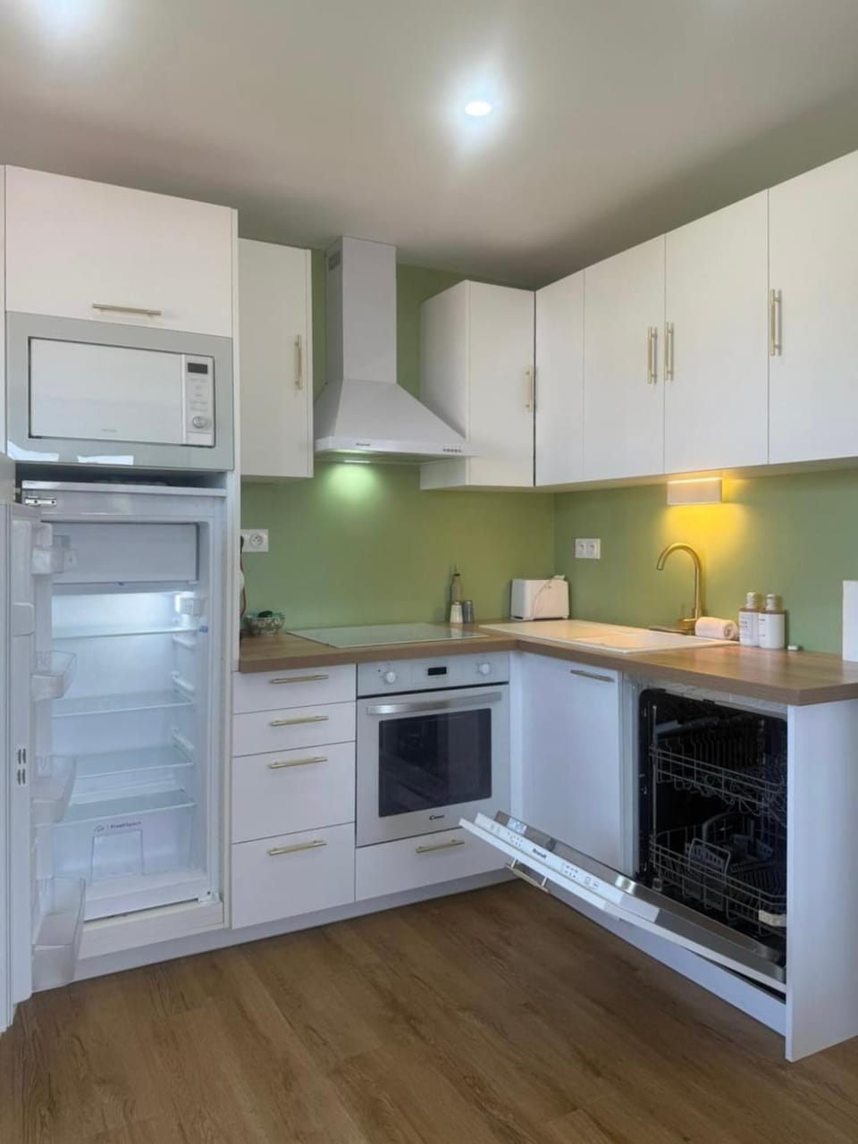Kitchen or kitchenette, dishwasher, microwave, oven, stove, toaster
