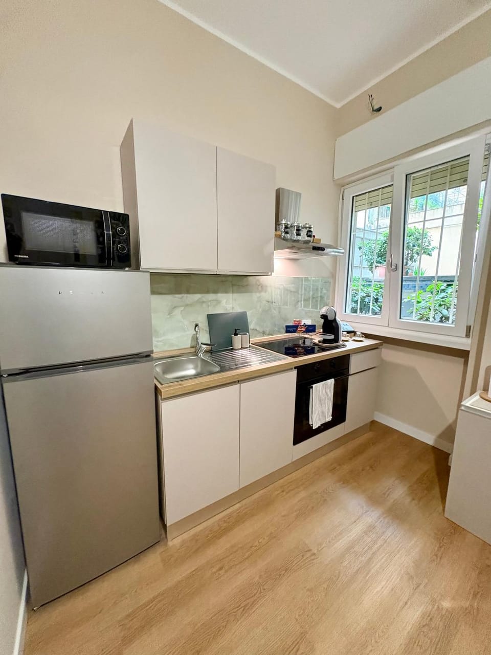 Kitchen or kitchenette, dishwasher, microwave, oven, stove