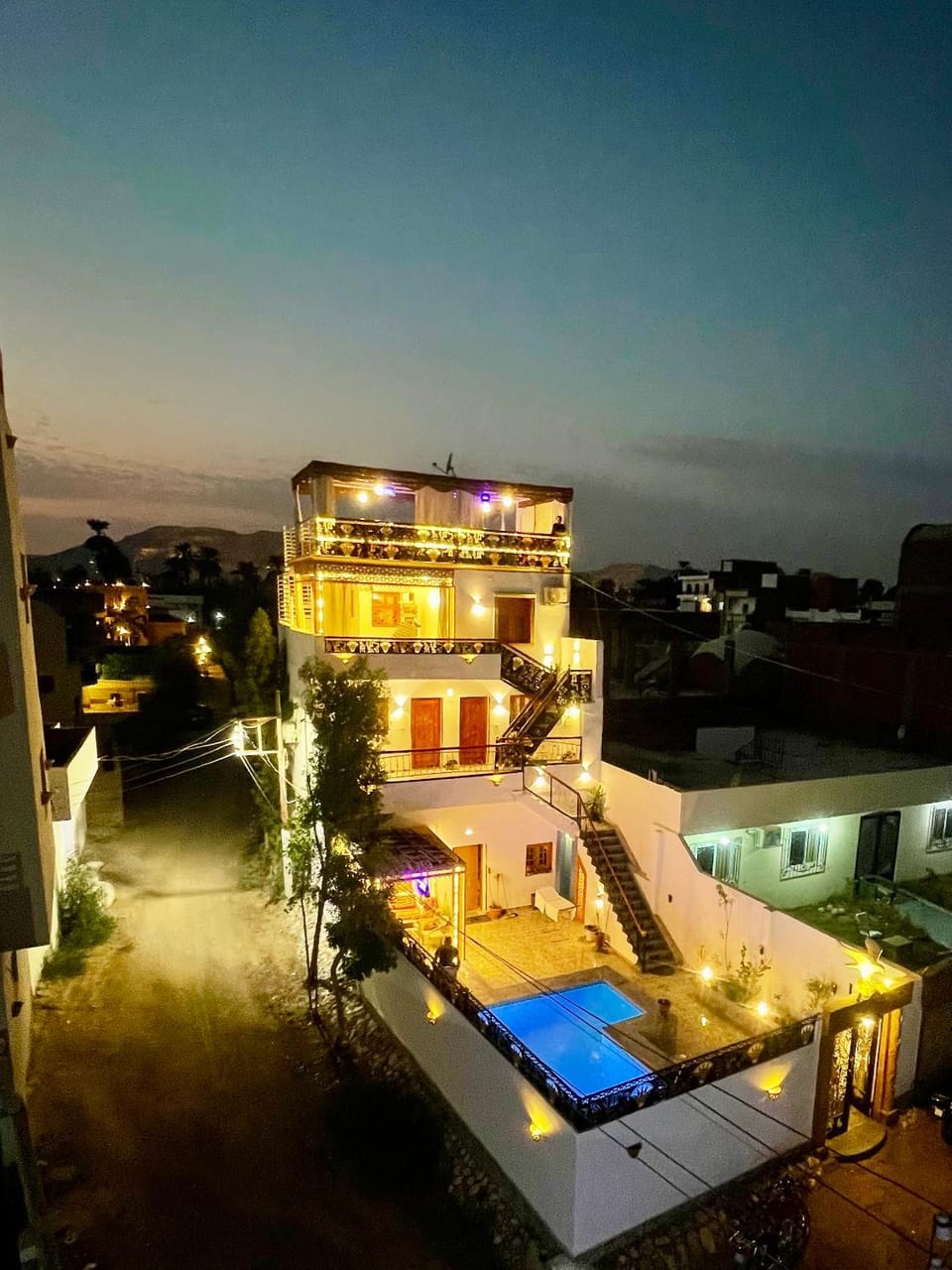 Property building, Patio, Night, View (from property/room), Balcony/Terrace, Pool view, Swimming pool, sunbed