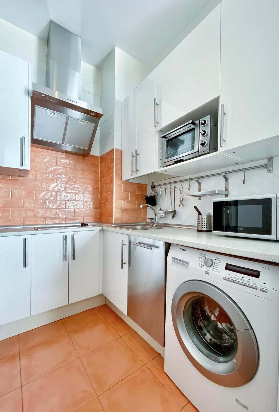 Kitchen or kitchenette, dishwasher, oven, stove, washing machine