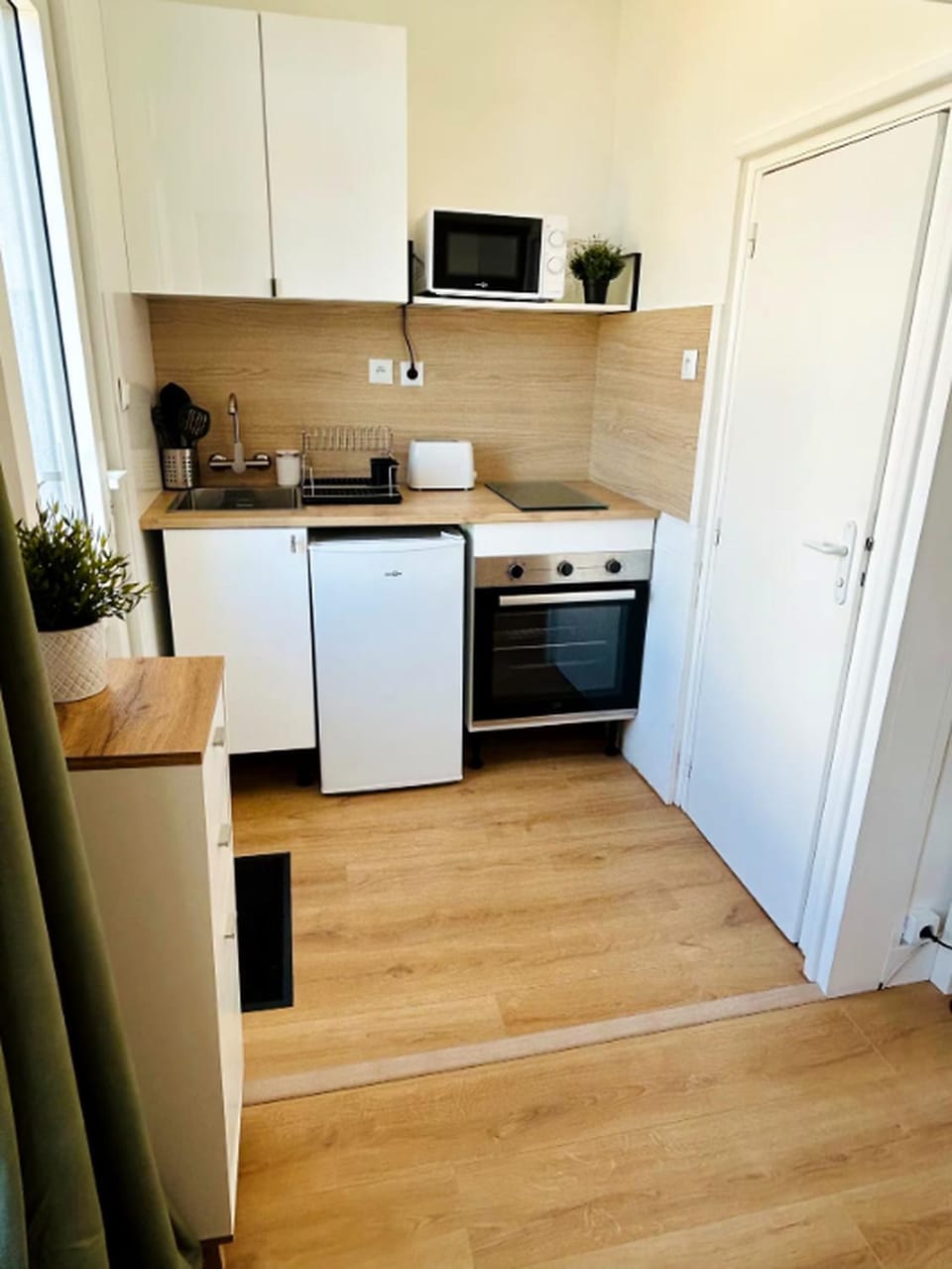 Kitchen or kitchenette, oven, stove, toaster