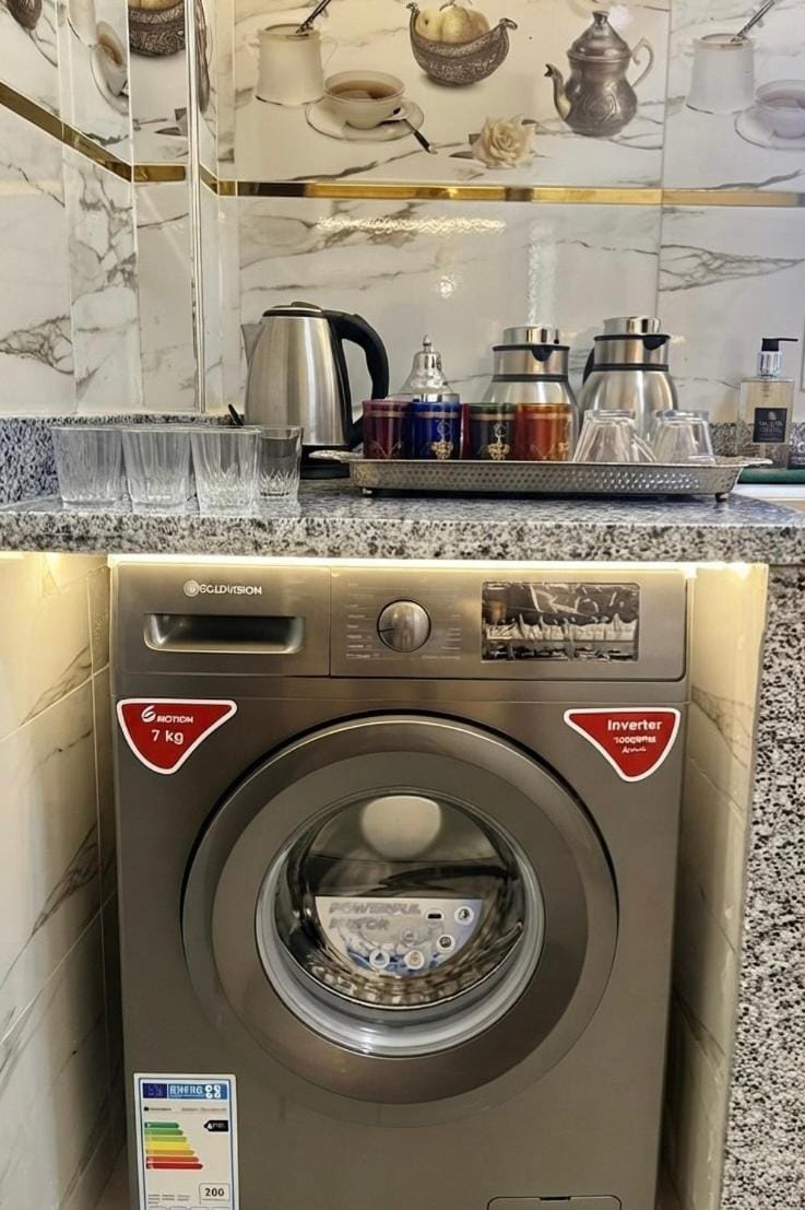 Kitchen or kitchenette, washing machine