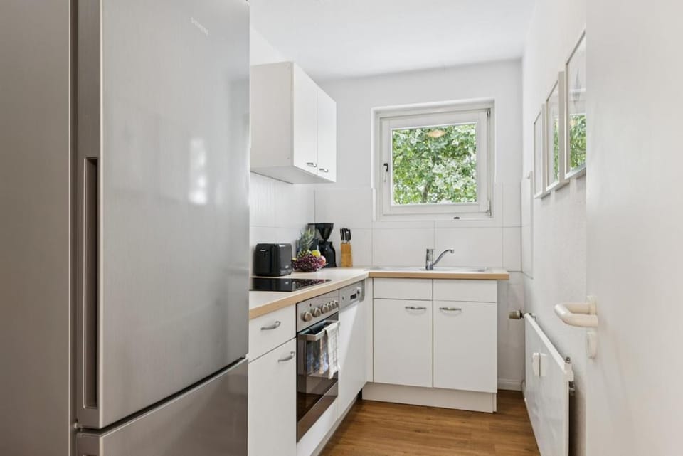 Kitchen or kitchenette, dishwasher, oven, stove