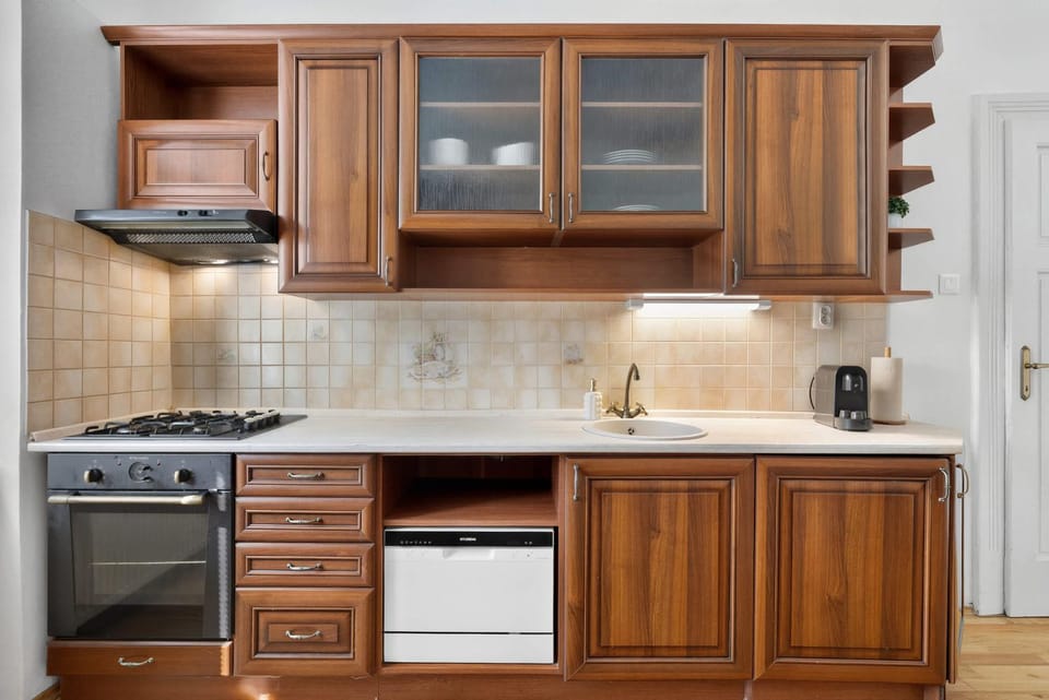 Kitchen or kitchenette, dishwasher, oven, stove
