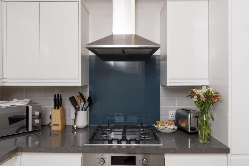 Kitchen or kitchenette, microwave, stove, toaster