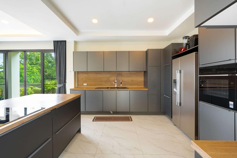 Kitchen or kitchenette, dishwasher, oven, stove