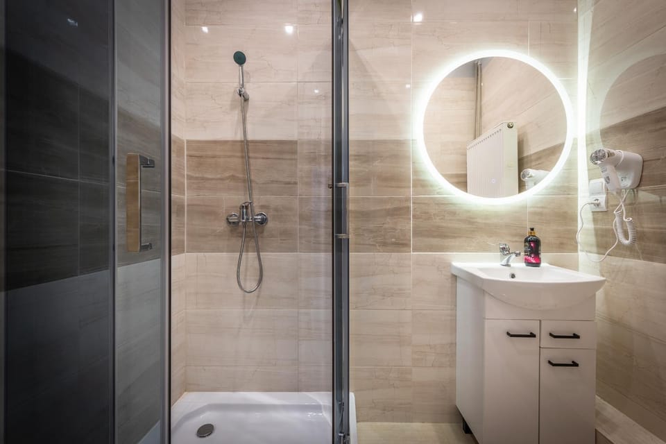 Shower, Toilet, Bathroom, hair dryier, towels