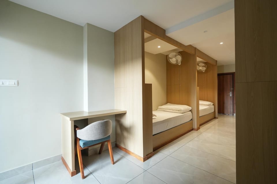 DORM BED in a shared 6 Bed Dormitory with common Swimming pool at Rasha Suites Kalpetta Wayanad Hostel in Kerala