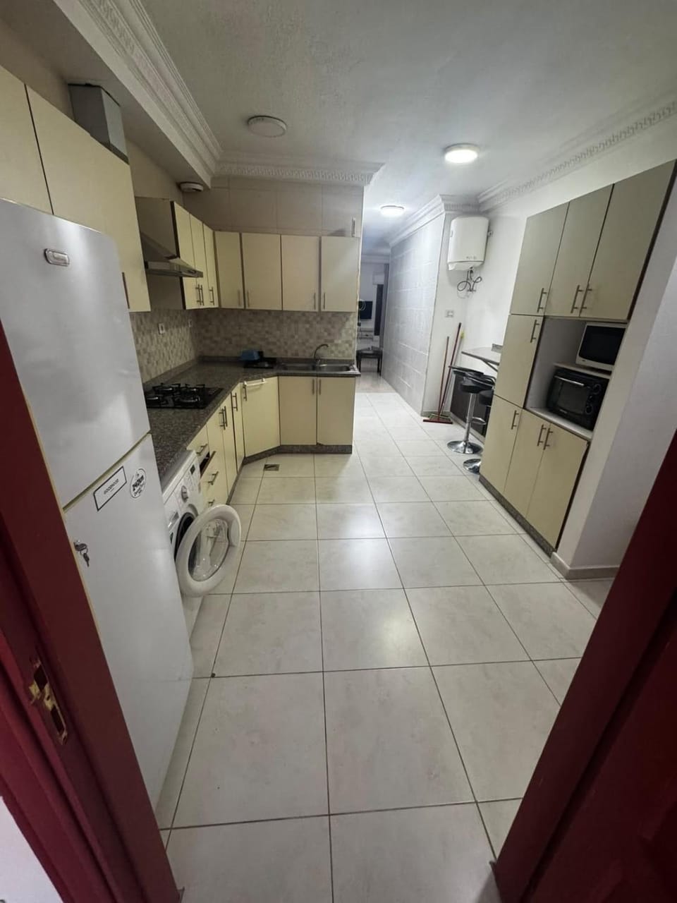 Kitchen or kitchenette, Dining area, microwave, oven, stove, washing machine