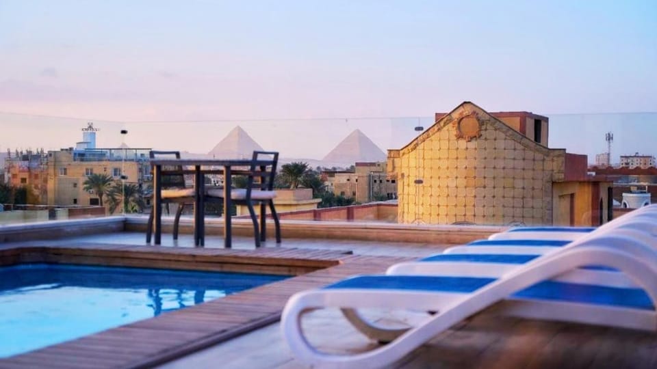 Restaurant/places to eat, View (from property/room), Swimming pool