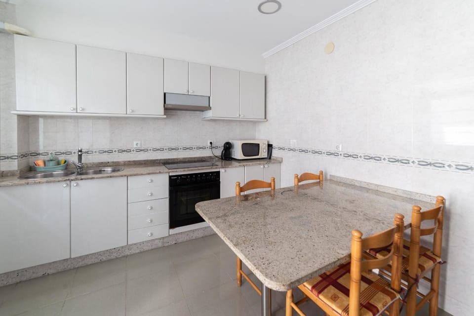 Kitchen or kitchenette, dishwasher, oven, stove, toaster