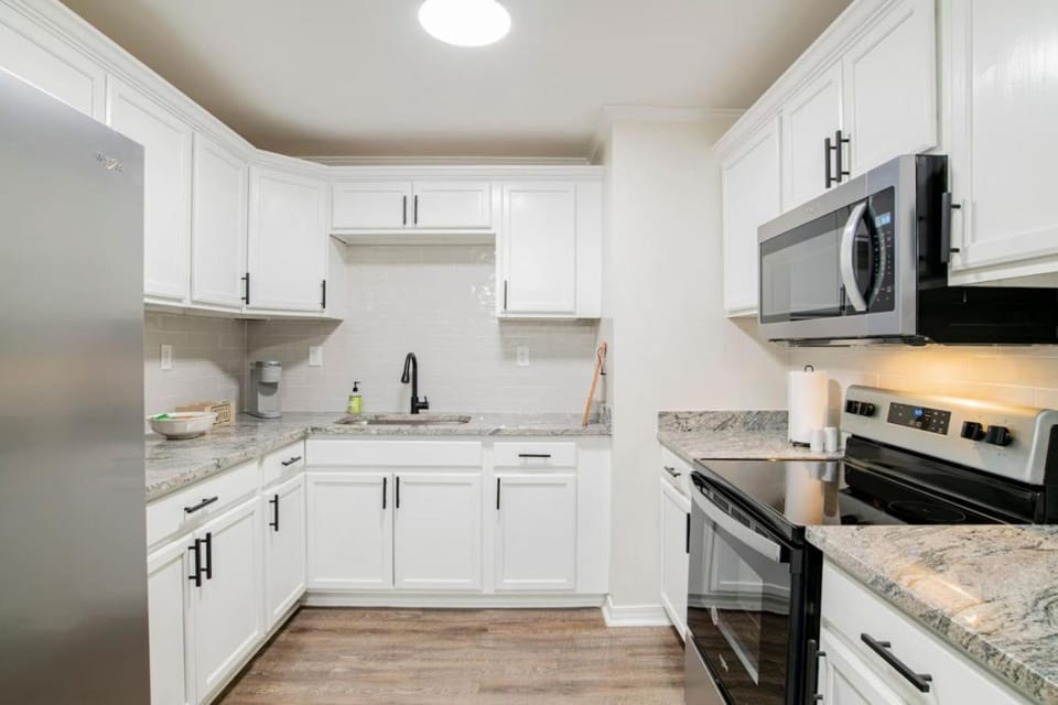 Kitchen or kitchenette, dishwasher, oven, stove