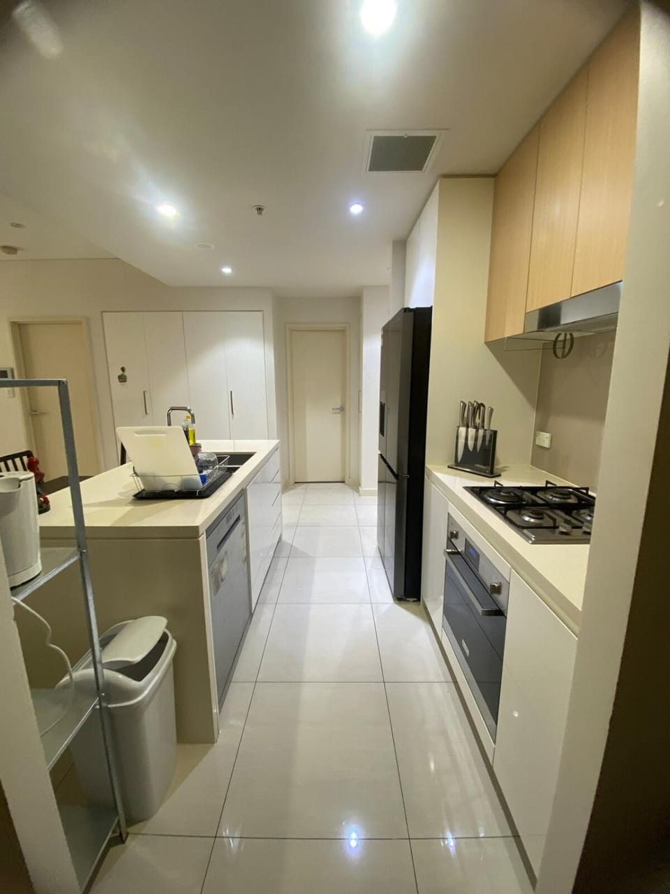 Kitchen or kitchenette, dishwasher, oven, stove