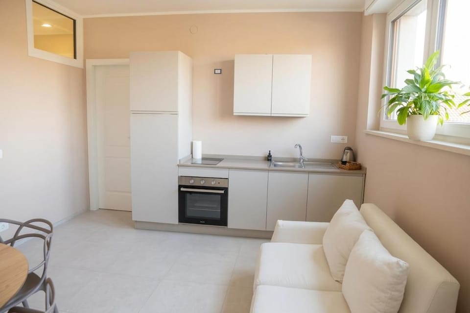 Kitchen or kitchenette, Living room, Seating area, stove