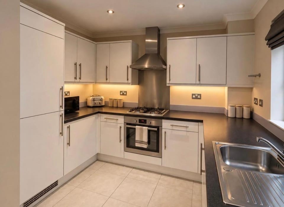 Kitchen or kitchenette, oven, storage, stove