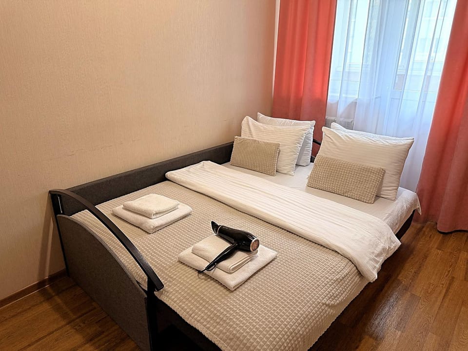 Bed, Photo of the whole room, Bedroom, hair dryier, towels