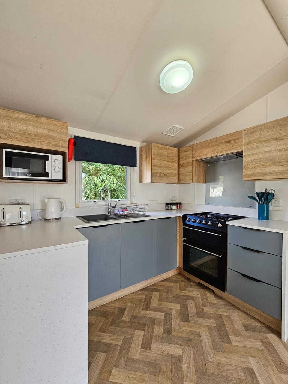 Kitchen or kitchenette, dishwasher, oven, stove, toaster