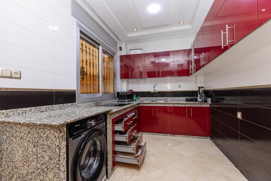 Kitchen or kitchenette, stove, washing machine, dryer