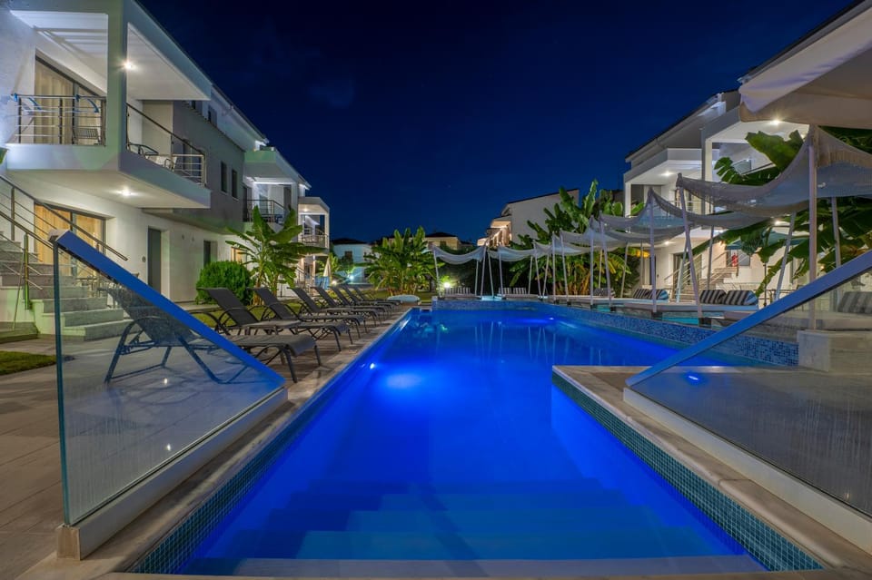 Property building, Night, Pool view, Swimming pool, sunbed